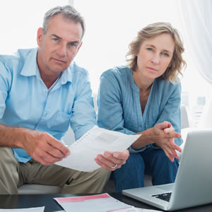 serious-couple-holding-papers-2